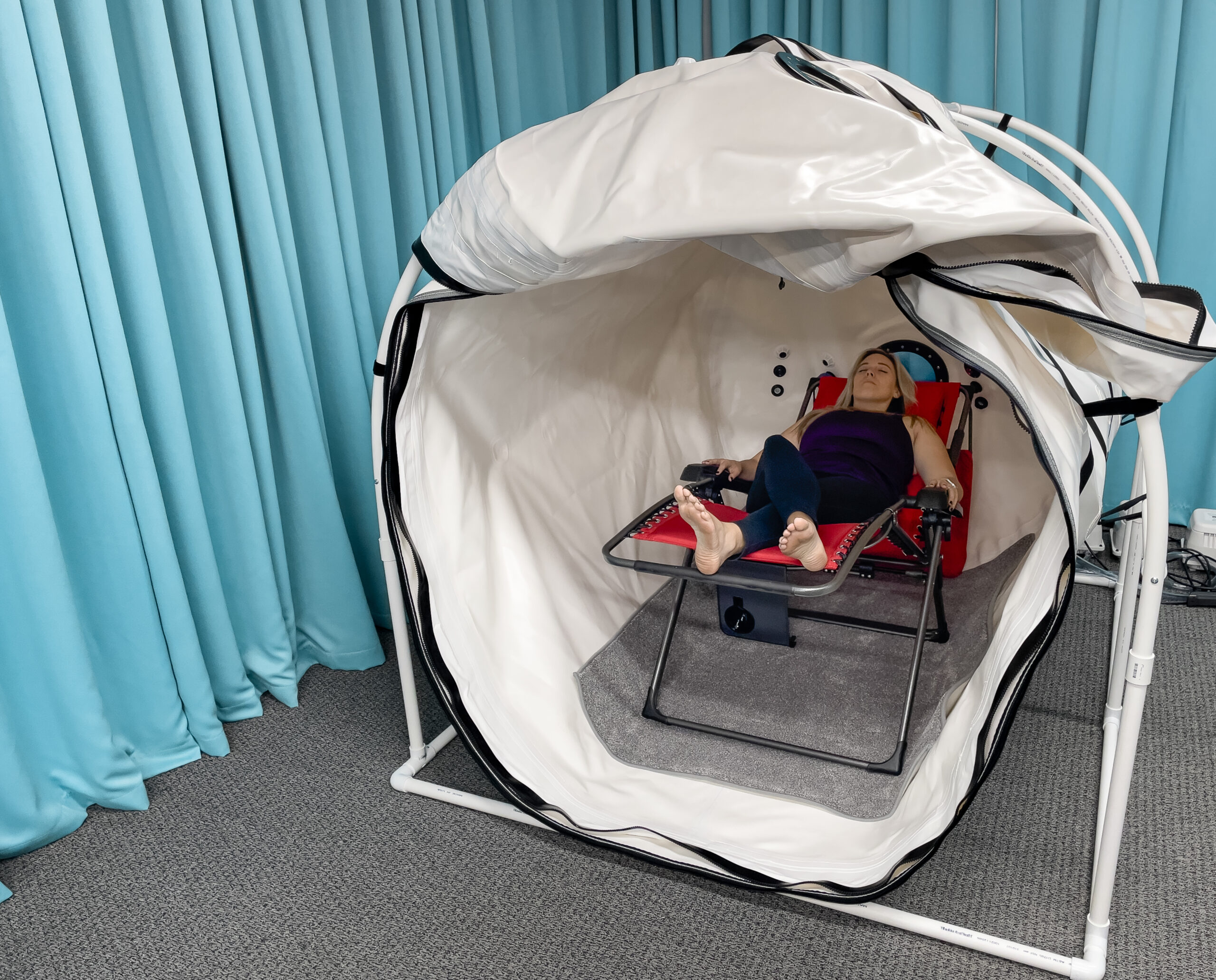 Person relaxing in Summit to Sea hyperbaric chamber